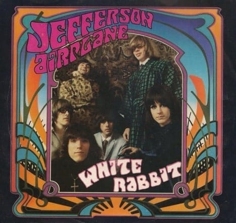 Album cover for Jefferson Airplane's 1967 single: White Rabbit. This features a frame of traditional 1960's psychedelic artwork and fonts, surrounding the band, who is posing for a picture, wearing traditional 60's garments.