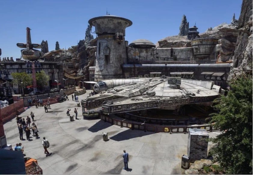 Overhead image of Disneyland's Galaxy's Edge. A land dedicated to the Star Wars franchise. Various ships and buildings from the galaxy far, far away are on display, most notably, the Millennium Falcon as the centerpiece of this theme park attraction.