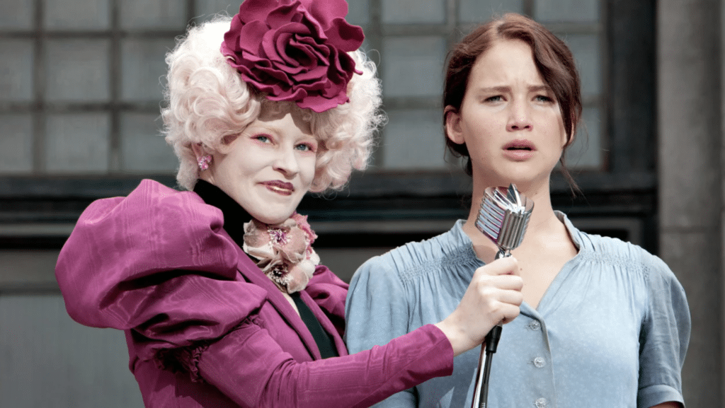 Elizabeth Banks as Effie Trinket and Jennifer Lawrence as Katniss Everdeen in "The Hunger Games".