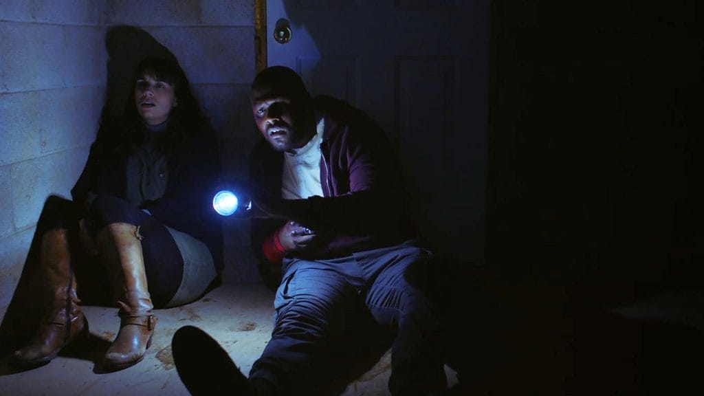 Adrienne Kress and Ryan Allen in the 2023 horror film "The Devil Comes at Night".