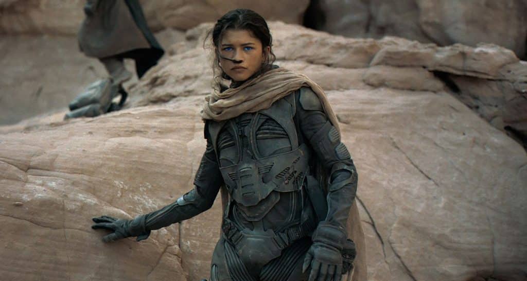 Still image of Zendaya as Chani, wearing an armored bodysuit and breathing tube, from the 2021 Denis Villeneuve film "Dune".