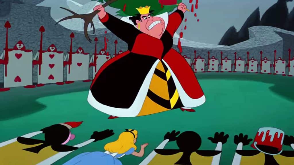 Still image of the Queen of Hearts ripping up a tree as Alice lies face down from the 1951 Disney film "Alice in Wonderland".