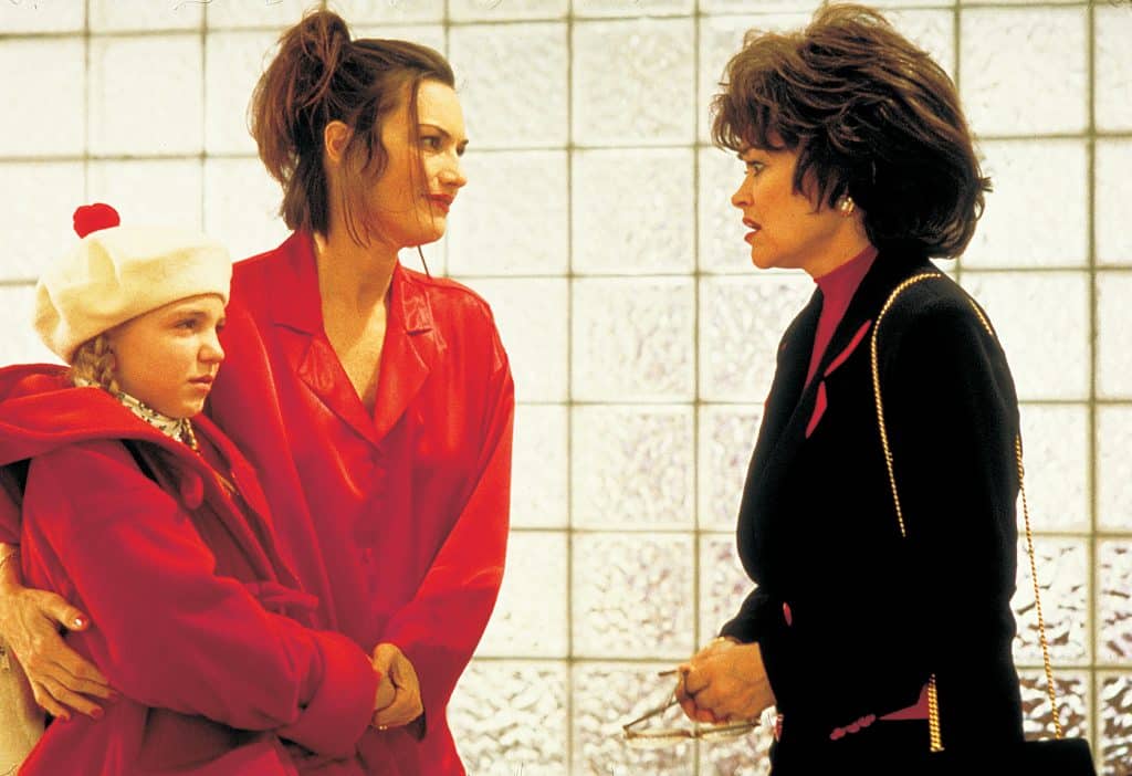 Still image from the thriller movie "Wicked" featuring Vanessa Zima, Linda Hart, and Chelsea Field. 