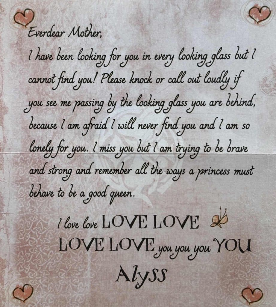 A letter written from Princess Alyss Heart to her mother Queen Genevieve on pale pink paper and decorated with red hearts in each corner.